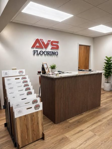 AVS Flooring showroom counter and flooring sample displays